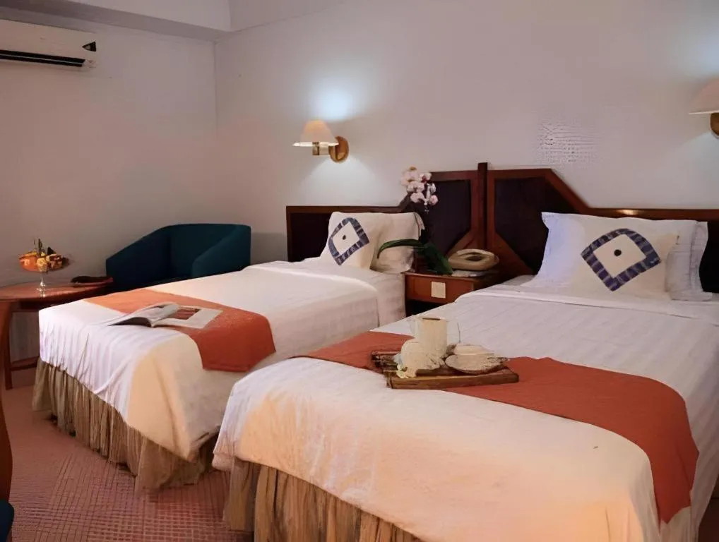 Bed in Sahid Kawanua Hotel