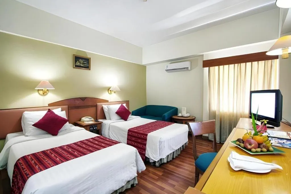 Bed in Sahid Kawanua Hotel