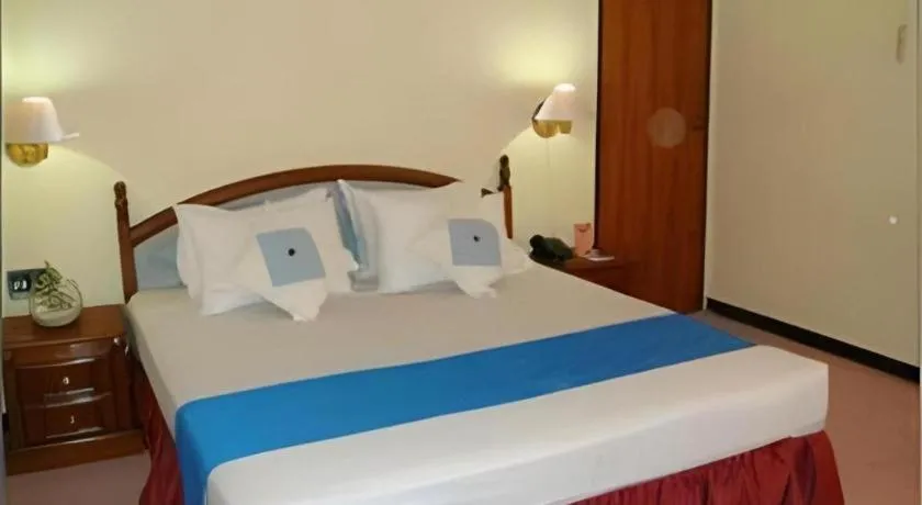 Bed in Sahid Kawanua Hotel