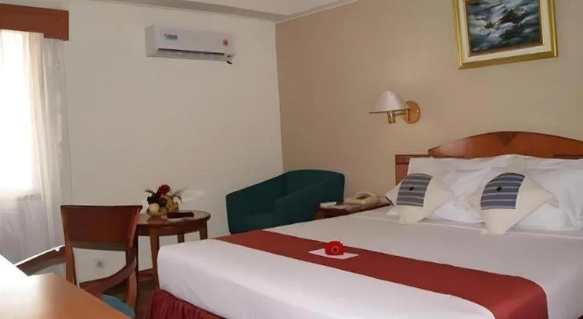 Bed in Sahid Kawanua Hotel