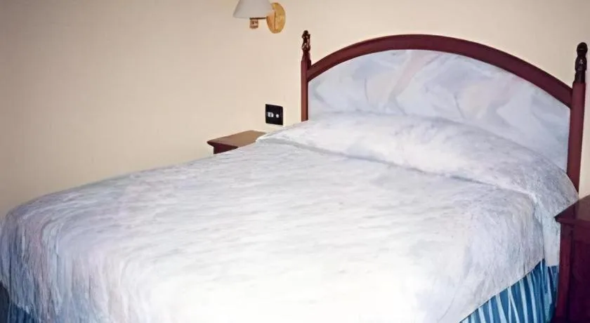 Bed in Sahid Kawanua Hotel