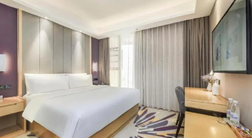 Bed in Lavande Hotel·Xishuangbanna Jinghong Songkran Square