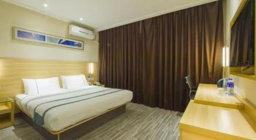 Bed in City Comfort Inn Chibi Railway Station Bed in City Comfort Inn Chibi Railway Station