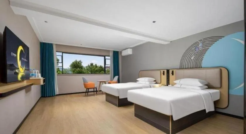 Bed in City Comfort Inn Chibi Railway Station