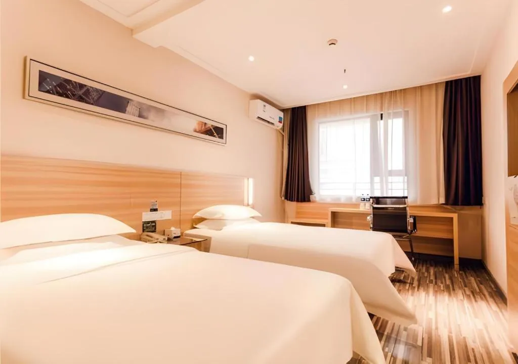 Bed in City Comfort Inn Chibi Railway Station