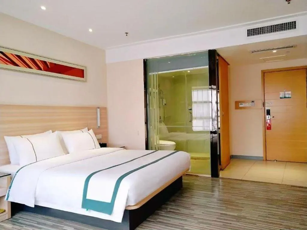 Bed in City Comfort Inn Zhongshan Shaxi Starbao Rosewood Expo City