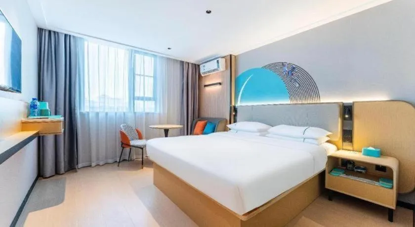 Bed in City Comfort Inn Zhongshan Shaxi Starbao Rosewood Expo City