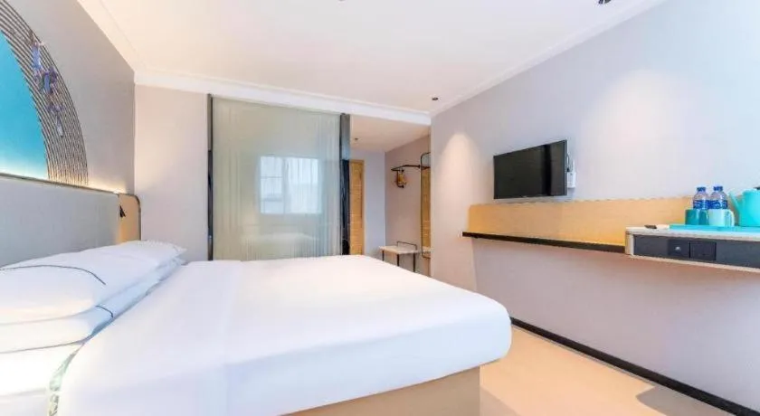 Bed in City Comfort Inn Zhongshan Shaxi Starbao Rosewood Expo City