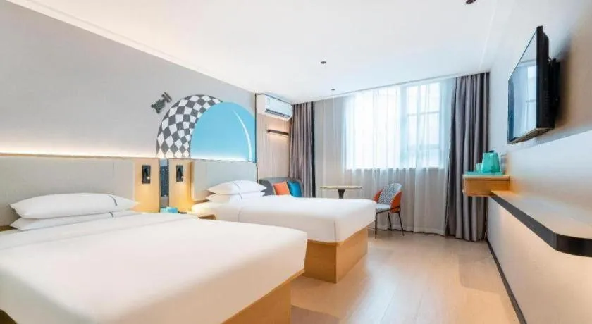 Bed in City Comfort Inn Zhongshan Shaxi Starbao Rosewood Expo City