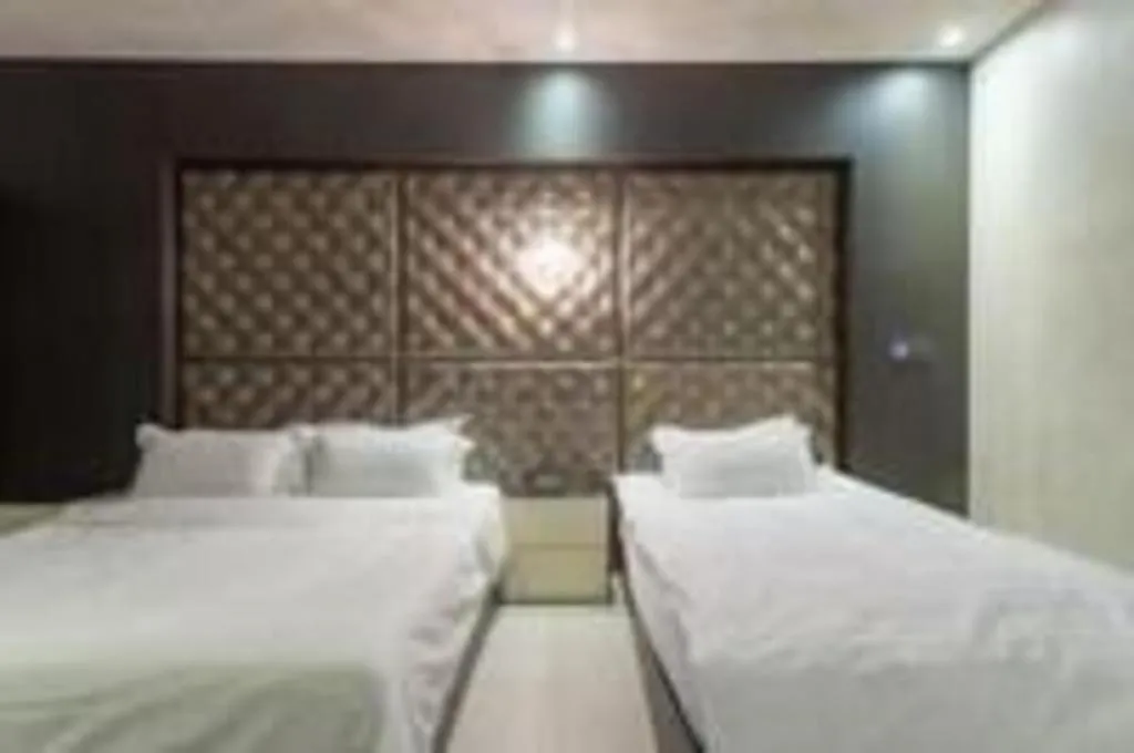 Bed in Qingdao Hengbo Hotel