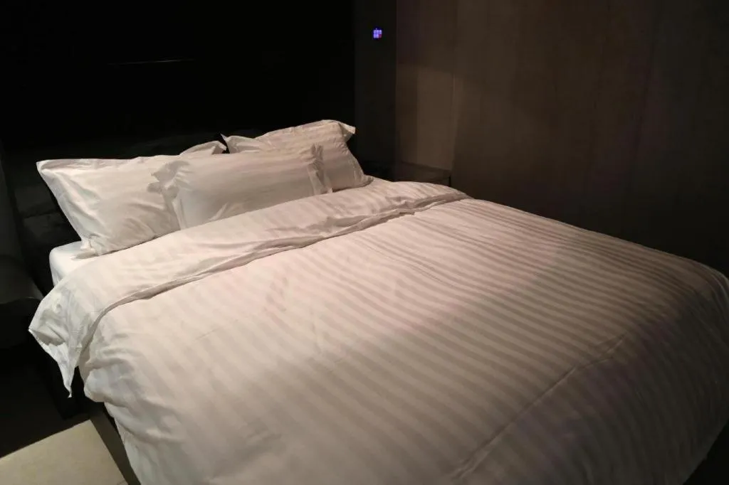 Bed in Qingdao Hengbo Hotel