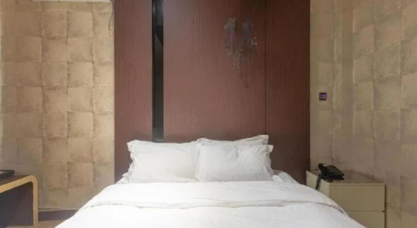 Bed in Qingdao Hengbo Hotel