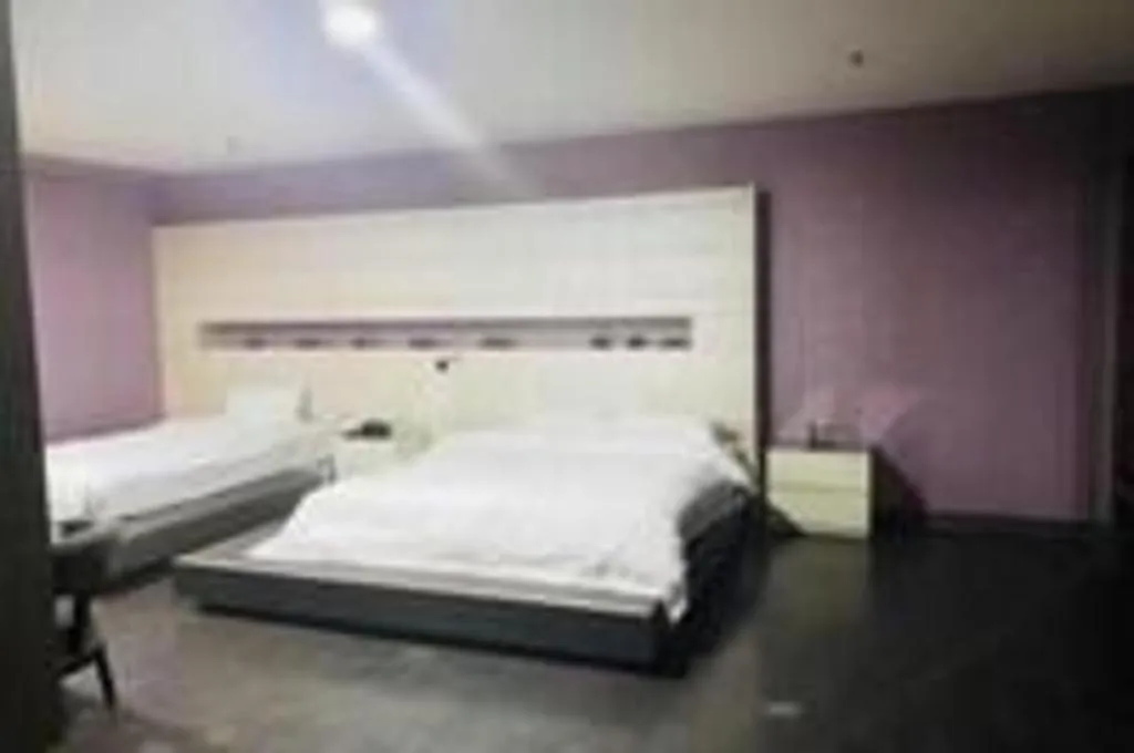 Bed in Qingdao Hengbo Hotel