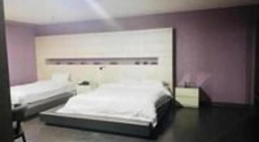 Bed in Qingdao Hengbo Hotel