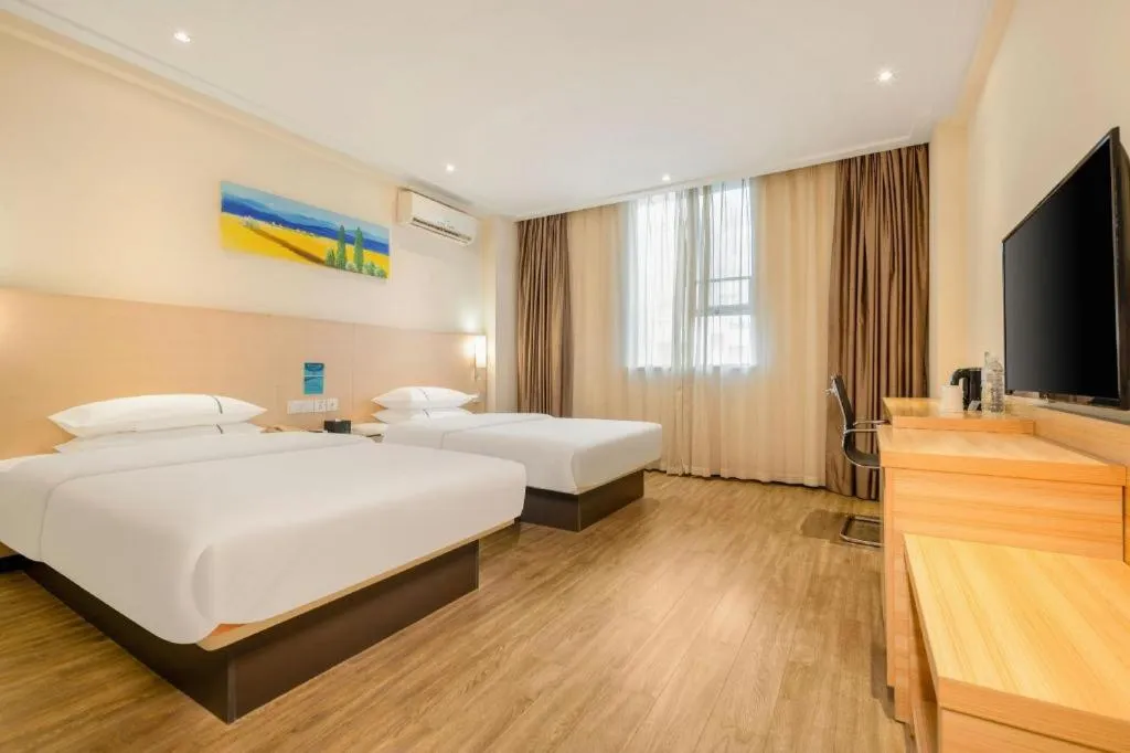 Bed in City Comfort Inn Wuzhou Wangcheng Square