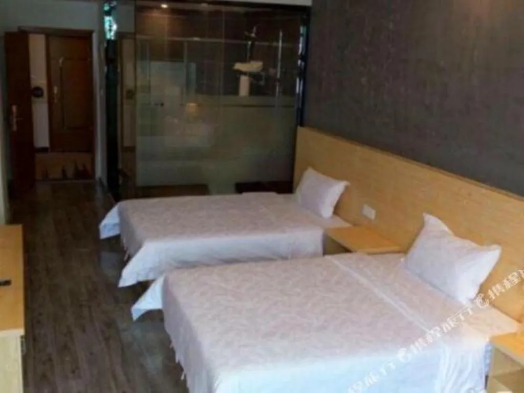 Bed in Yi Mi Hotel Shenzhen Longgang Pinghu South China City