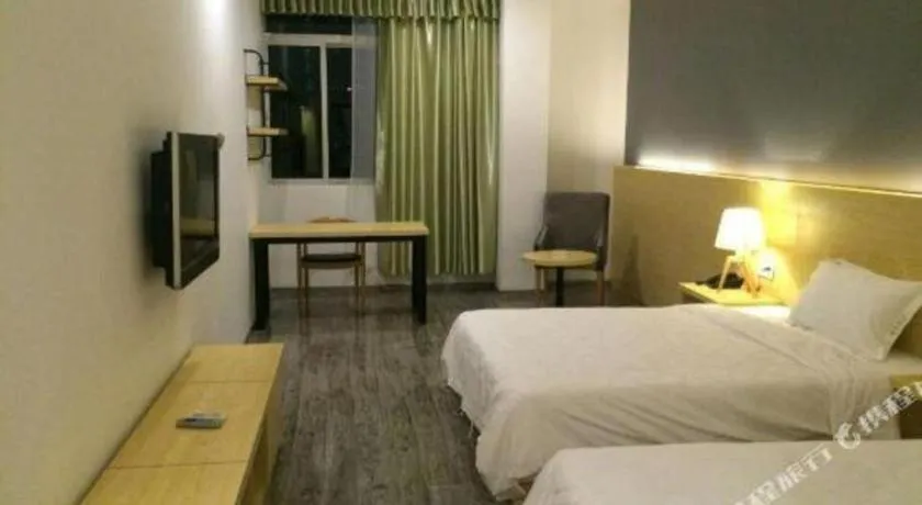 Bed in Yi Mi Hotel Shenzhen Longgang Pinghu South China City