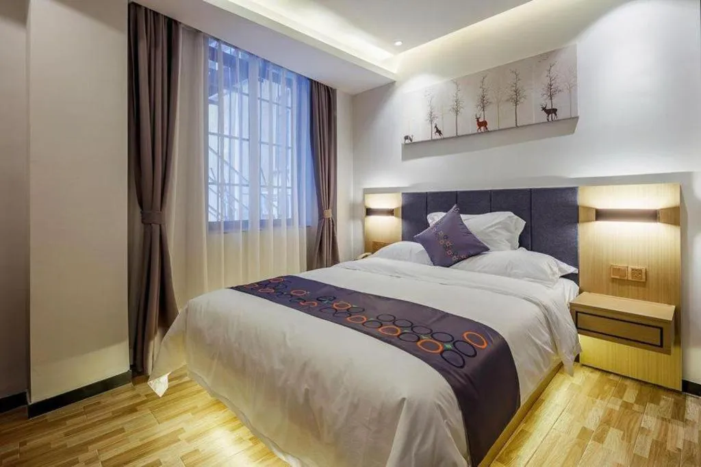 Bed in Yi Mi Hotel Shenzhen Longgang Pinghu South China City