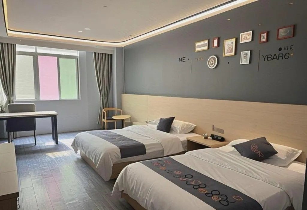 Bed in Yi Mi Hotel Shenzhen Longgang Pinghu South China City