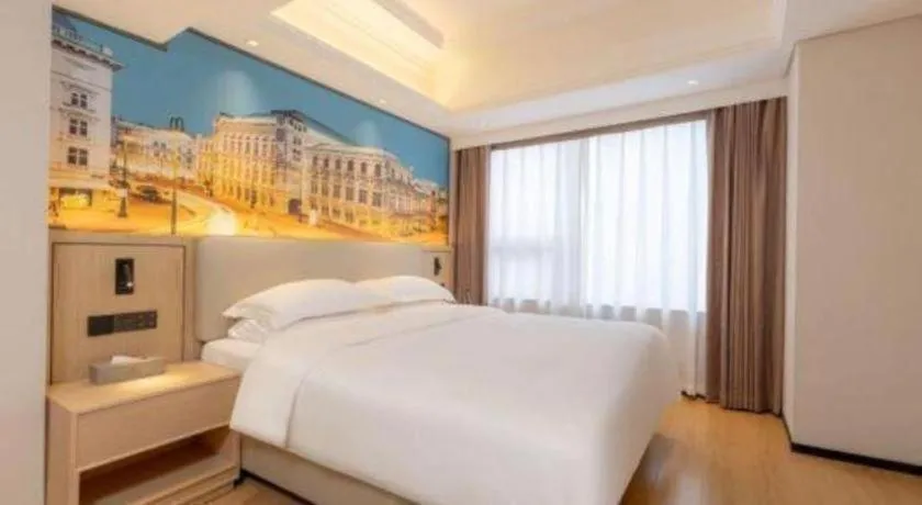 Bed in Vienna International Hotel Guangzhou Huangpu