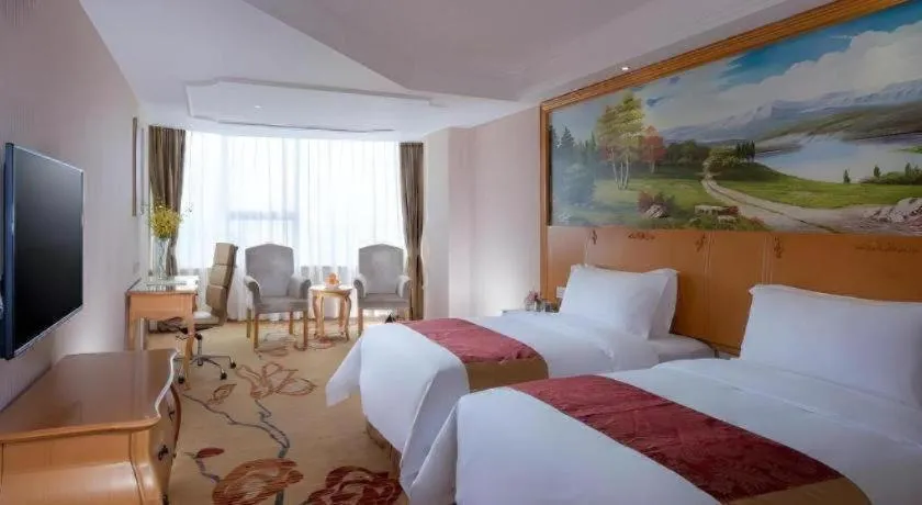 Bed in Vienna International Hotel Guangzhou Huangpu