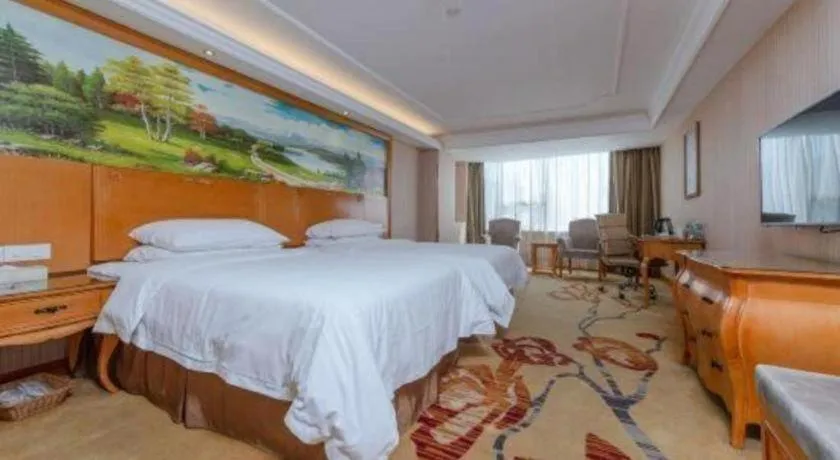 Bed in Vienna International Hotel Guangzhou Huangpu