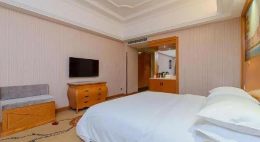 Bed in Vienna International Hotel Guangzhou Huangpu