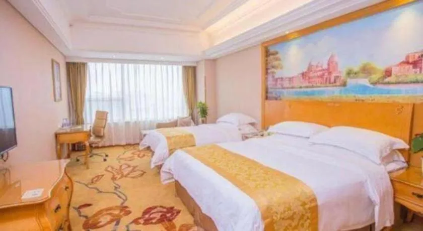 Bed in Vienna International Hotel Guangzhou Huangpu