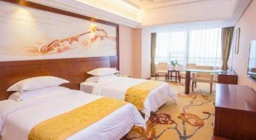 Bed in Vienna International Hotel Guangzhou Huangpu