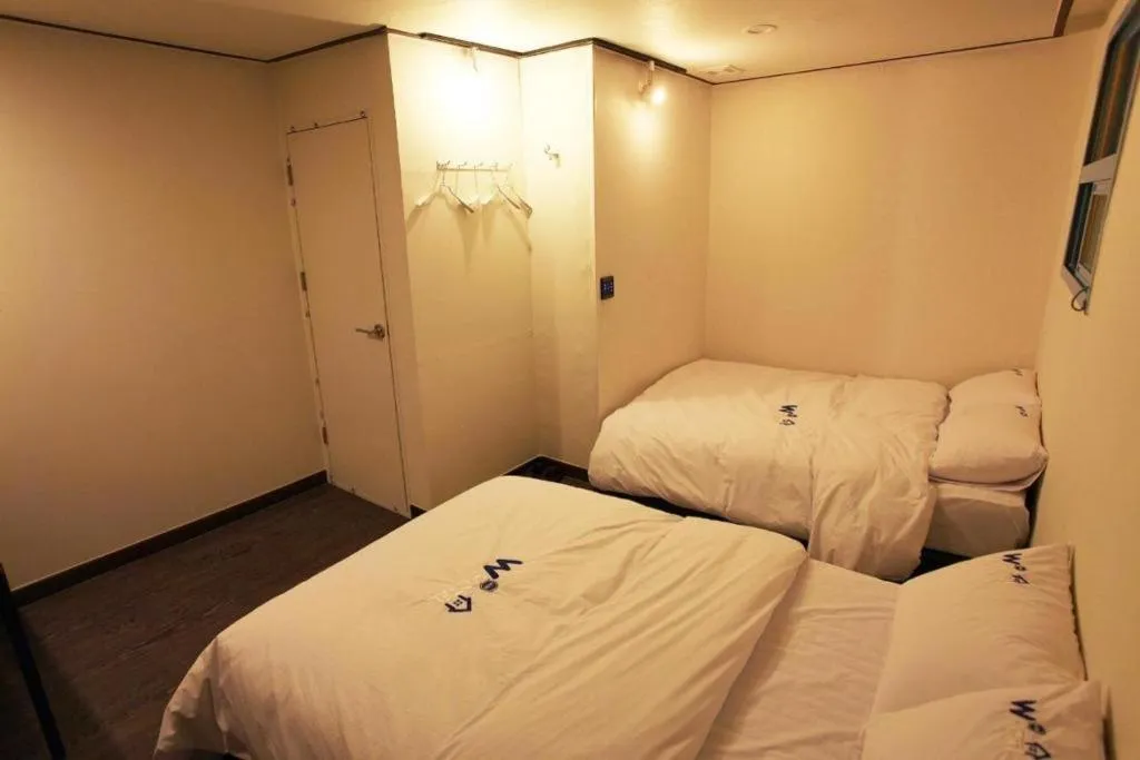 Bed in W Mini Hotel