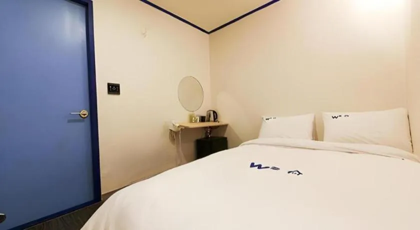 Bed in W Mini Hotel