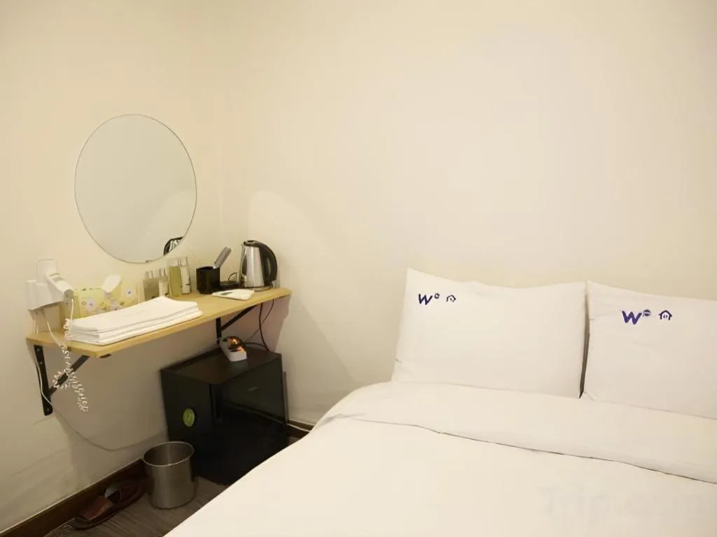 Bed in W Mini Hotel