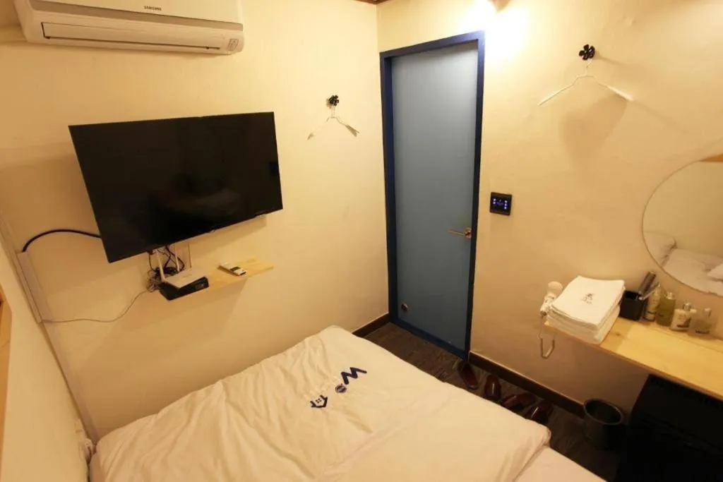 Bed in W Mini Hotel