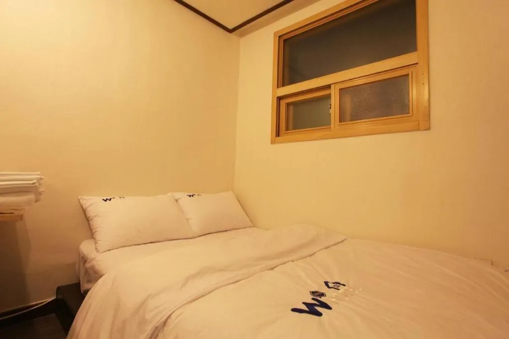 Bed in W Mini Hotel