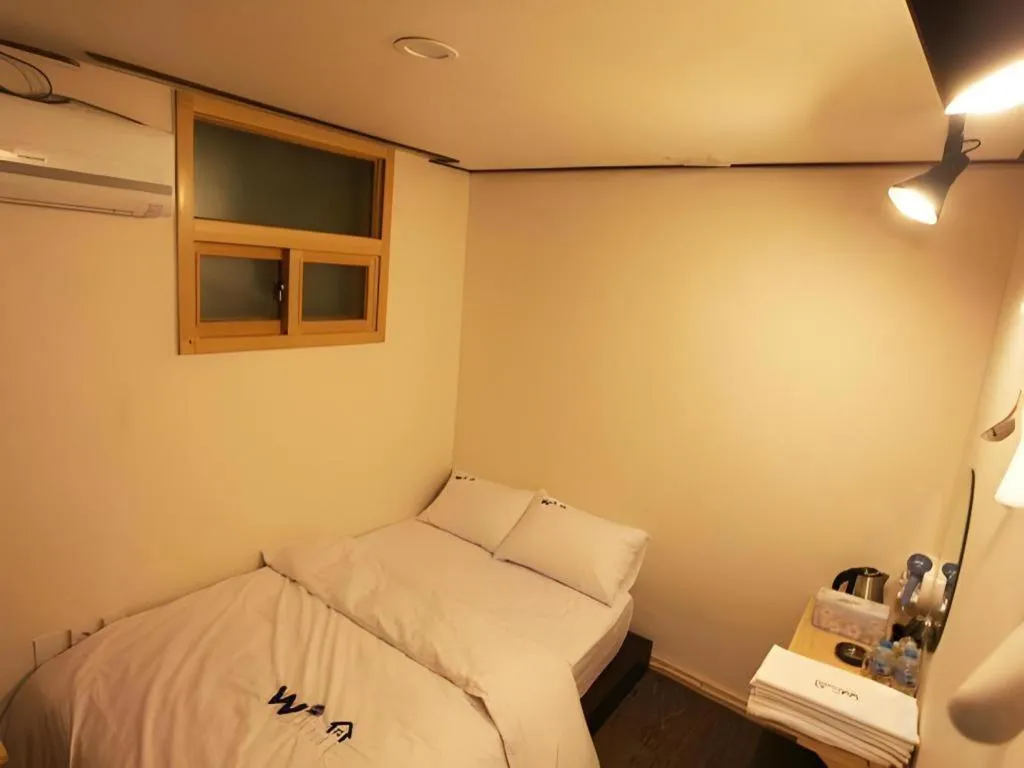 Bed in W Mini Hotel