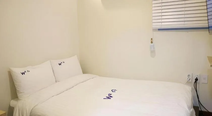Bed in W Mini Hotel