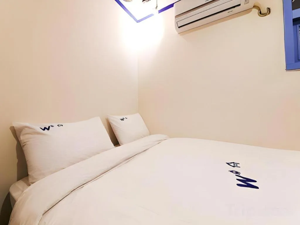 Bed in W Mini Hotel