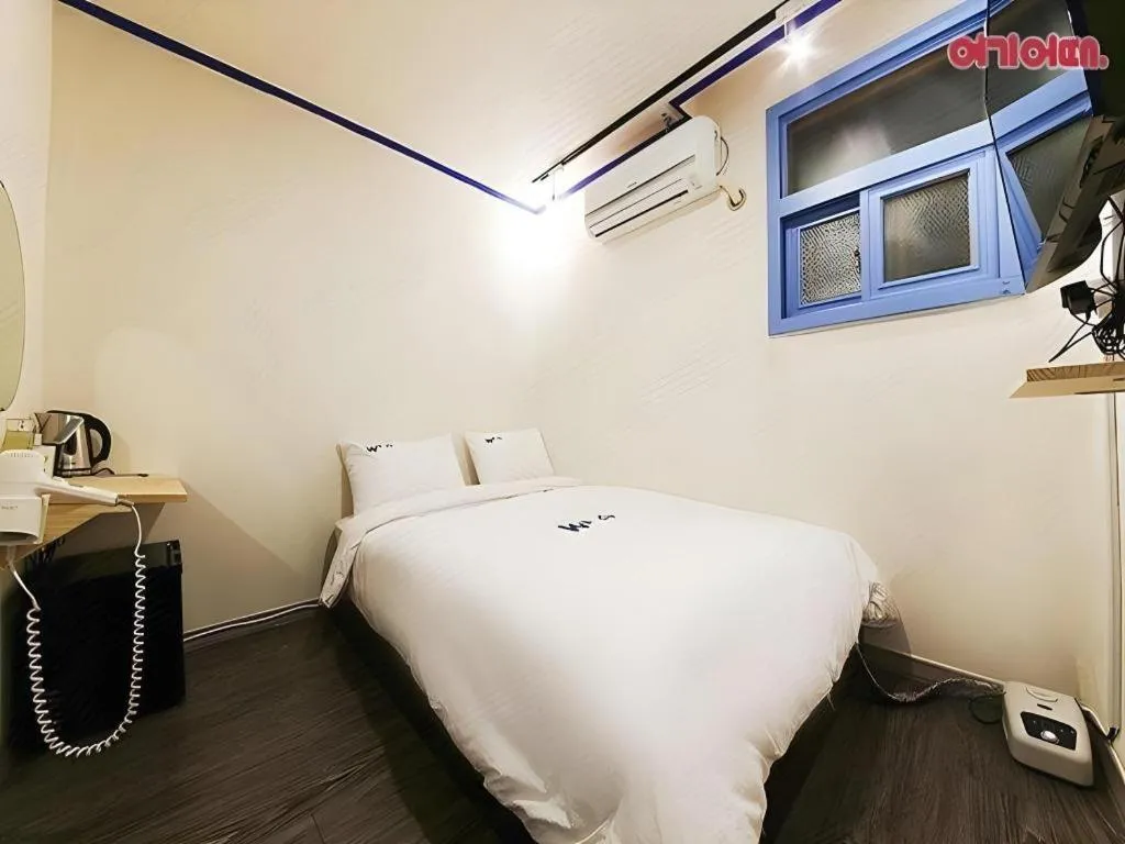 Bed in W Mini Hotel