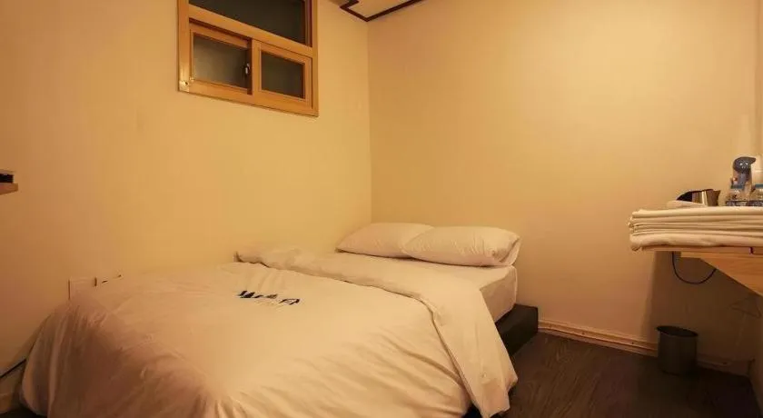 Bed in W Mini Hotel