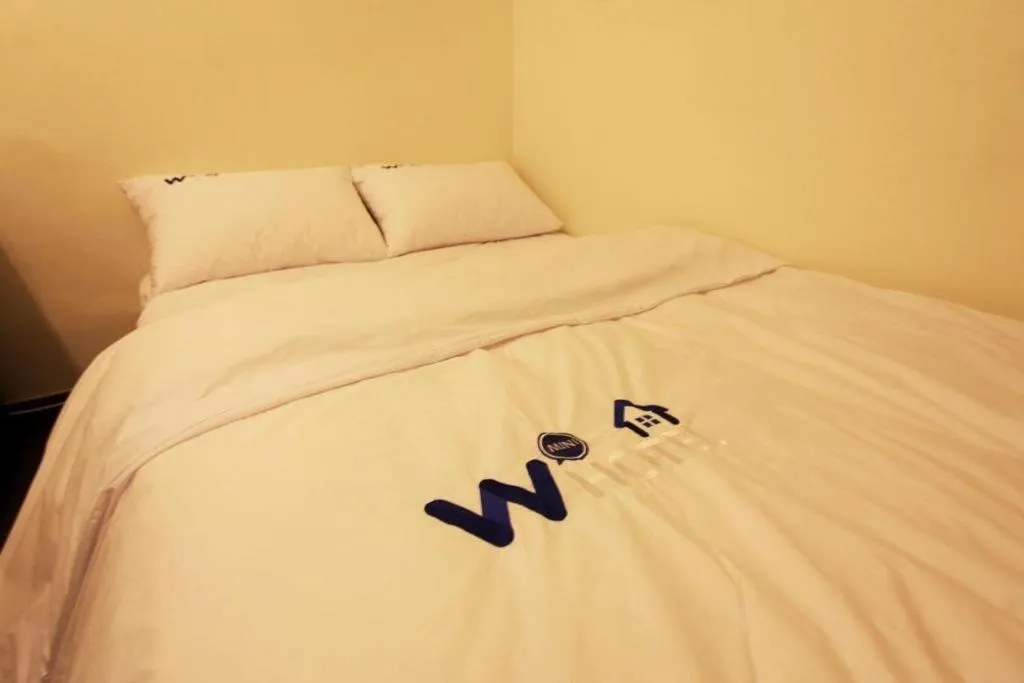 Bed in W Mini Hotel