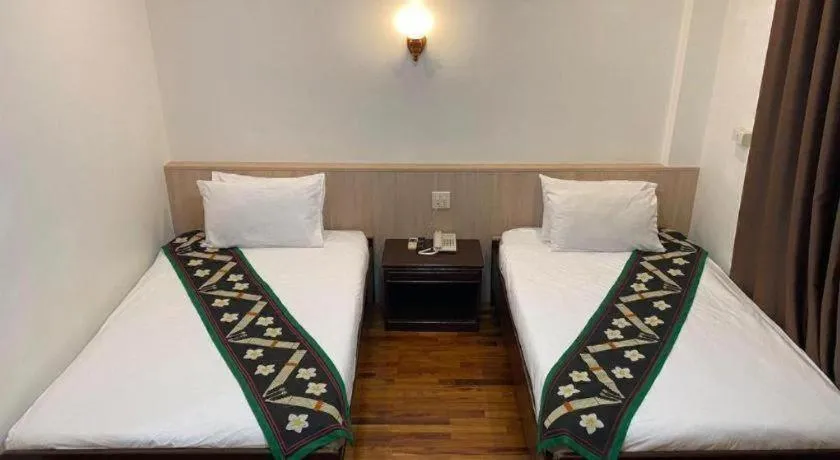 Bed in Anoulack Khen Lao Hotel