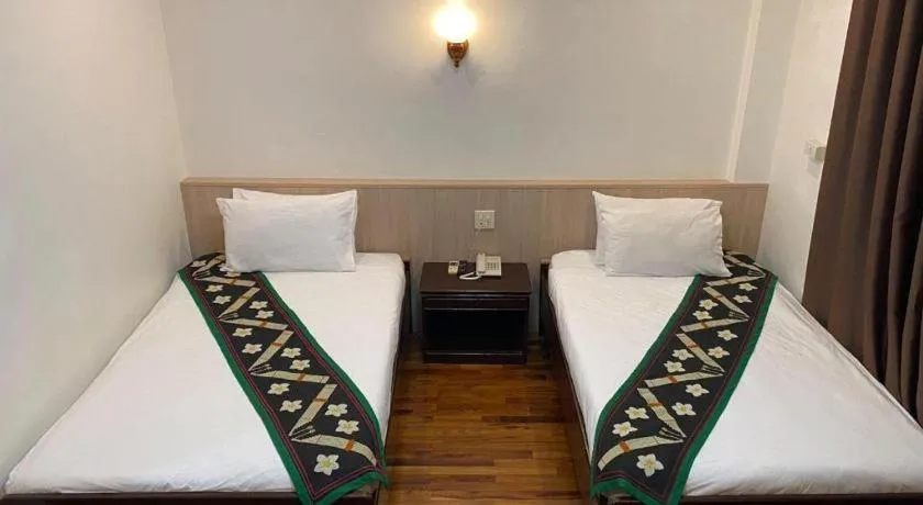 Bed in Anoulack Khen Lao Hotel