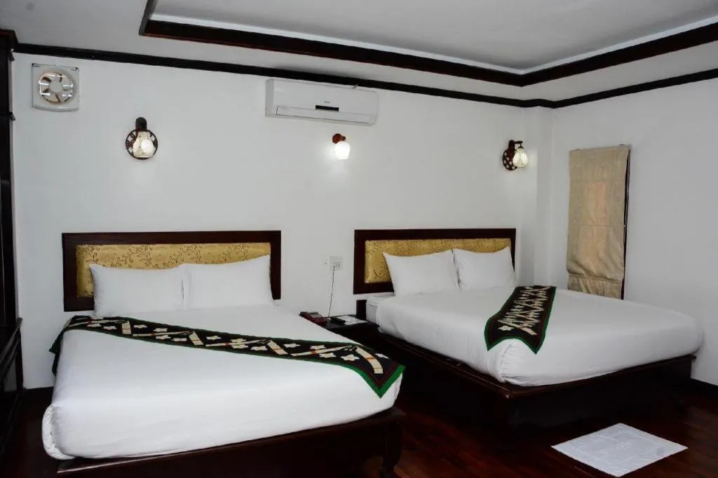 Bed in Anoulack Khen Lao Hotel