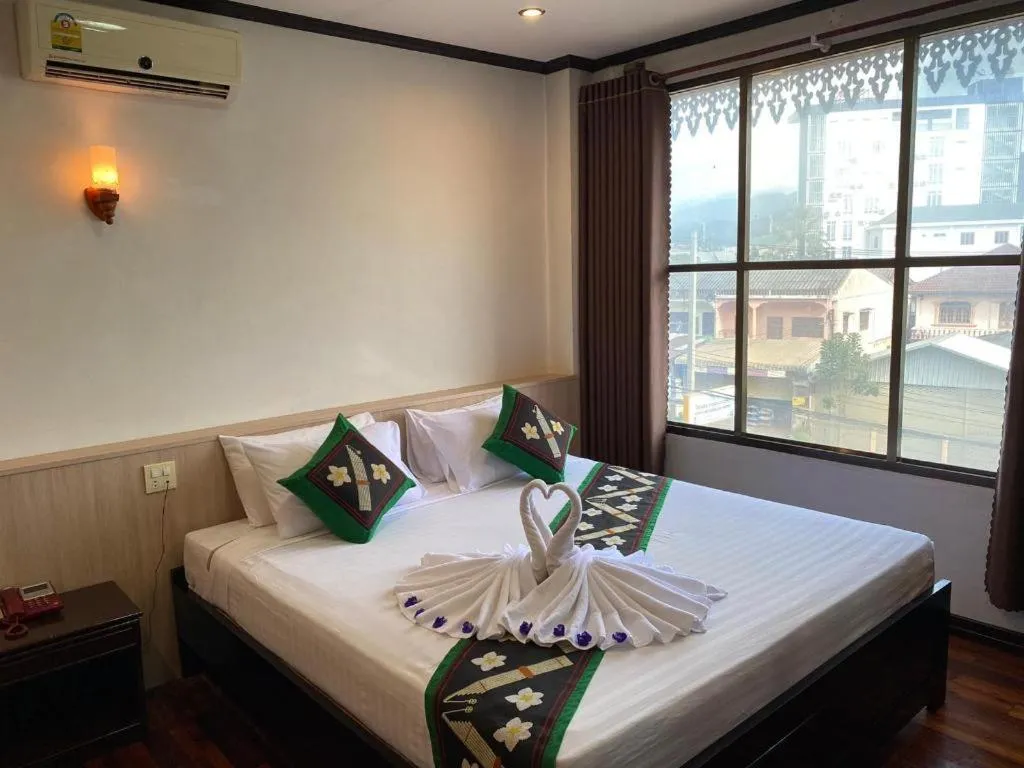 Bed in Anoulack Khen Lao Hotel