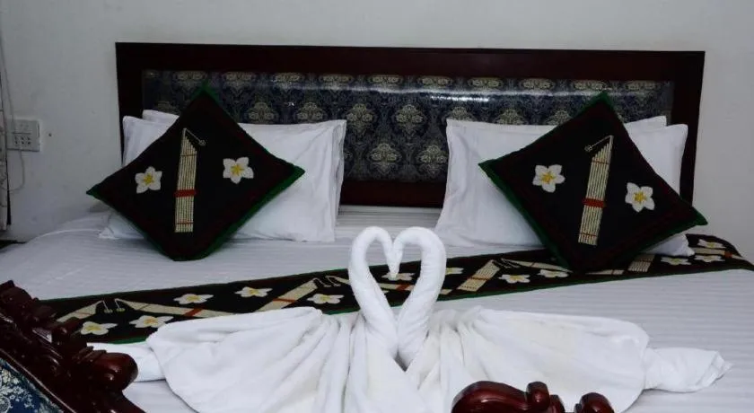 Bed in Anoulack Khen Lao Hotel