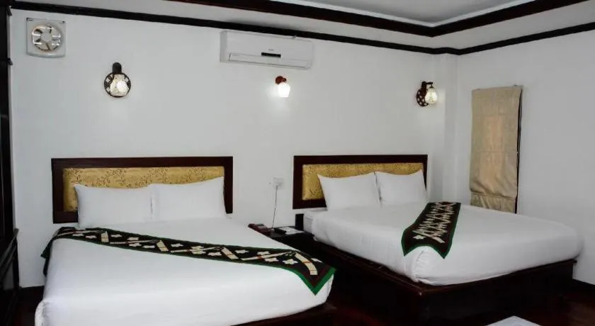 Bed in Anoulack Khen Lao Hotel