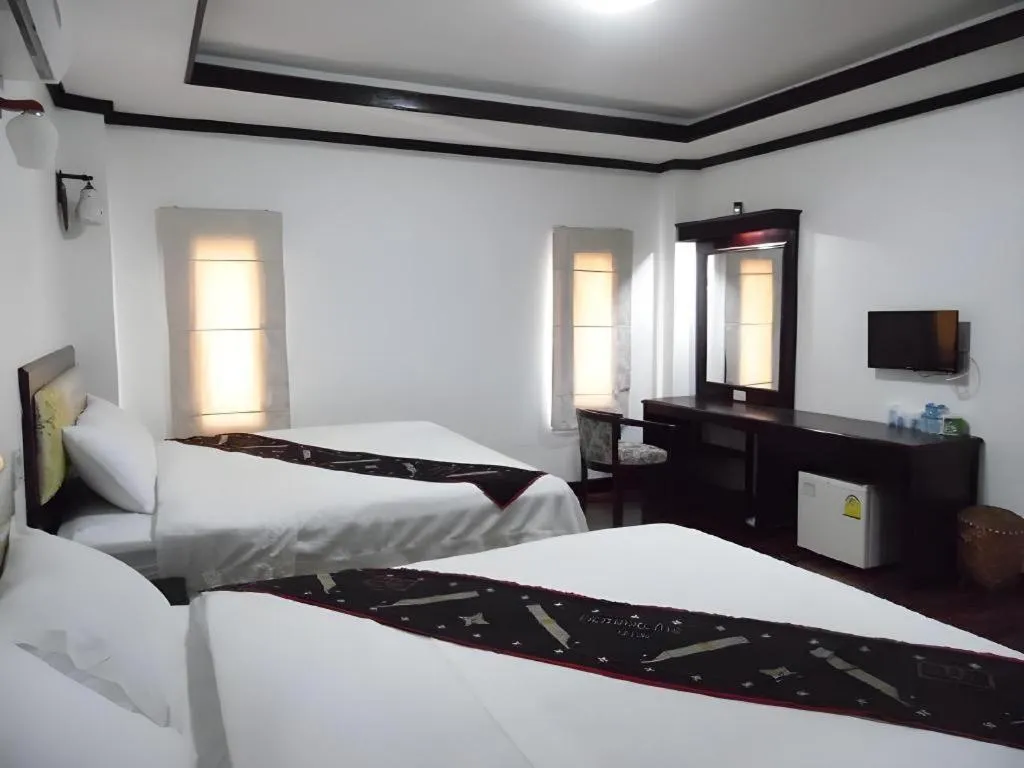 Bed in Anoulack Khen Lao Hotel