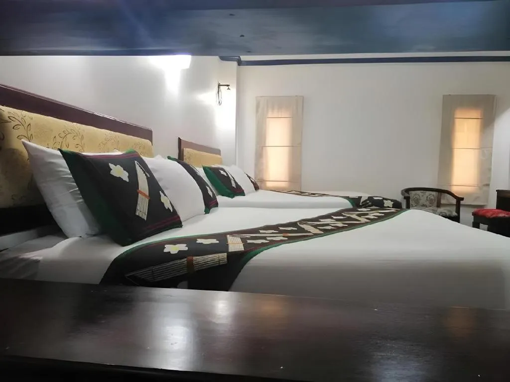 Bed in Anoulack Khen Lao Hotel