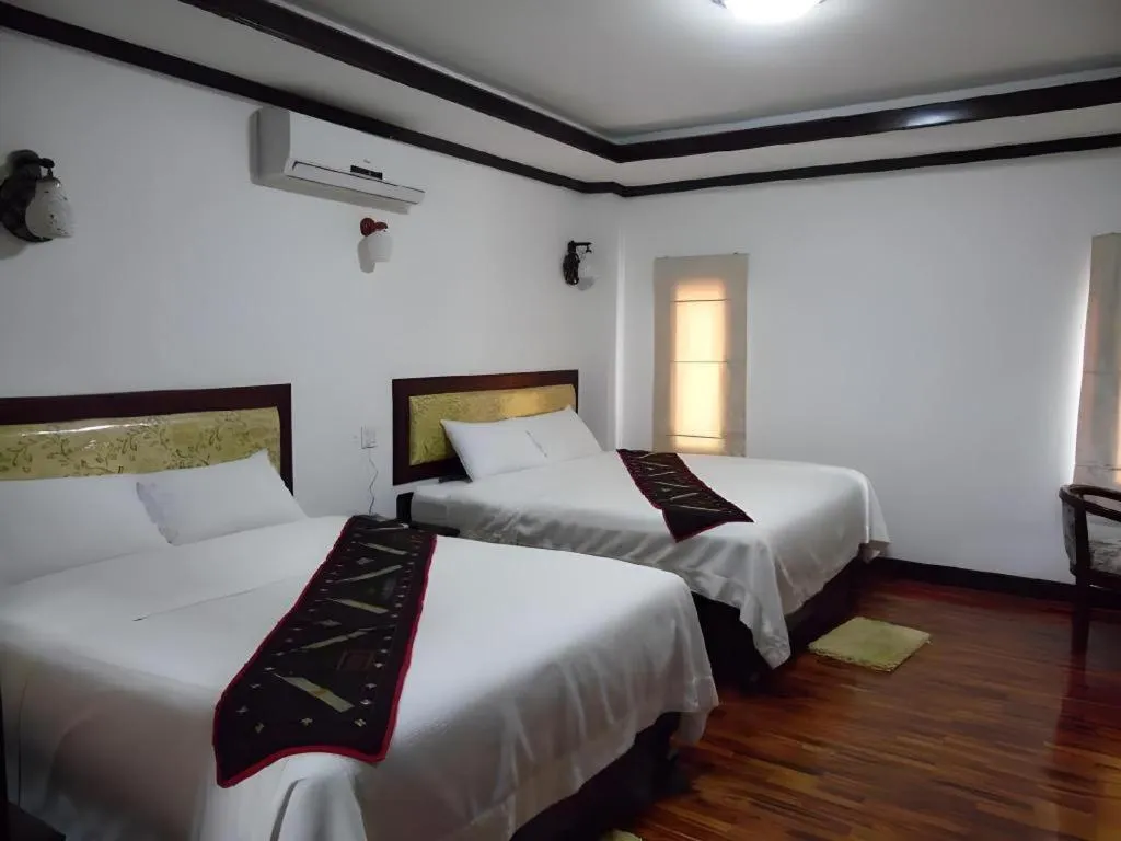 Bed in Anoulack Khen Lao Hotel