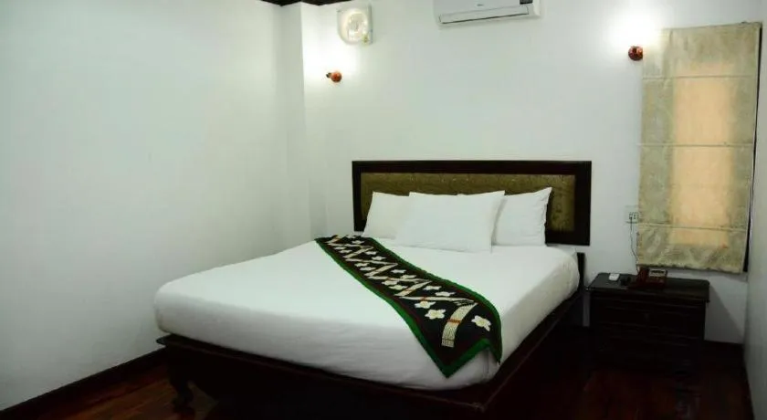 Bed in Anoulack Khen Lao Hotel